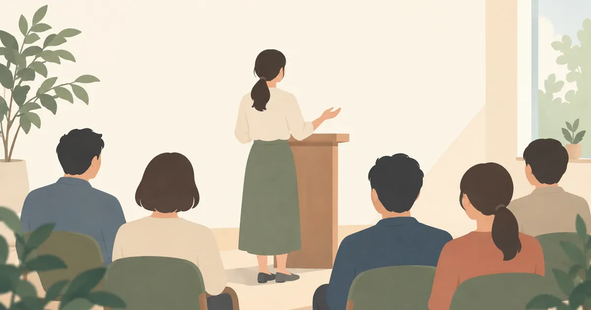 少人数の聞き手に向かって話す人の後ろ姿