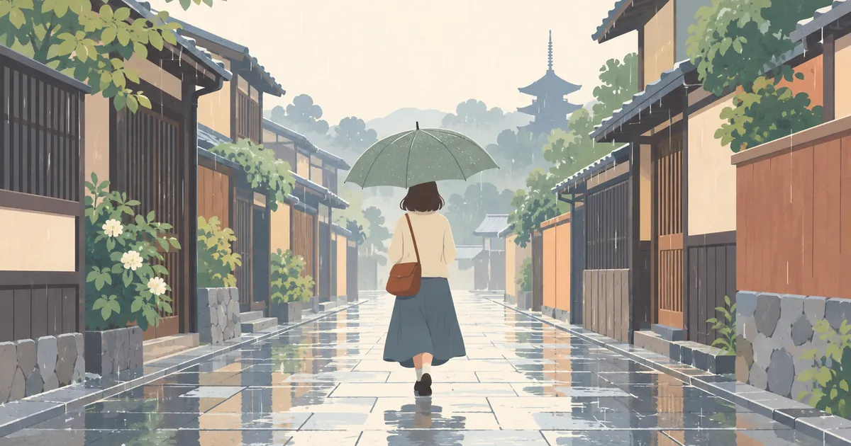 傘を差して雨の石畳を歩く旅行者